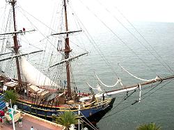 view of sailing ship from pier building