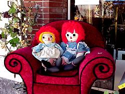 dolls in chair