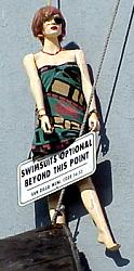 doll hung from wall