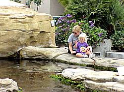 two sitting by tide pool