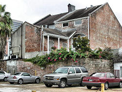 parking lot behind old brick building