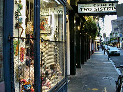 Court of Two Sisters sign at night