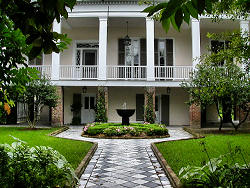 fountain in fron of old home