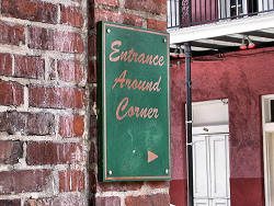 Entrance around corner sign