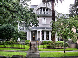 victorian home with gate and fence