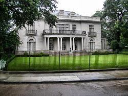 large old home behind fence