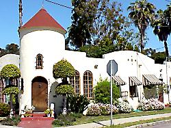 Spanish style home on corner with tower