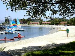 beach, water and sail boats at hotel