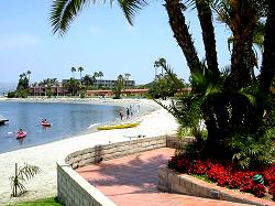 brick walkway to beach and sailboats