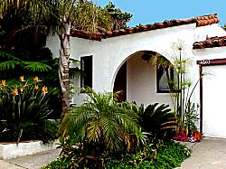 Spanish home with landscaping