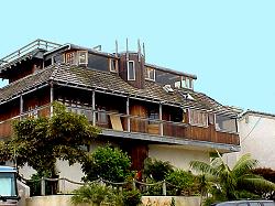 wooden home with many additions to the view