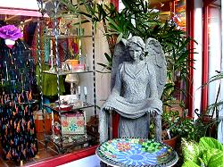 stone statue of angel for sale in patio at Bazaar del Mundo